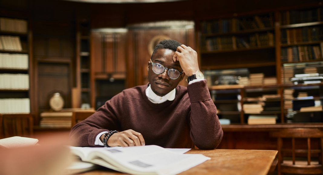 student library studying upset stressed