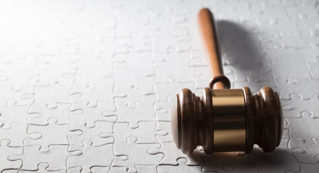 Gavel on jigsaw puzzle