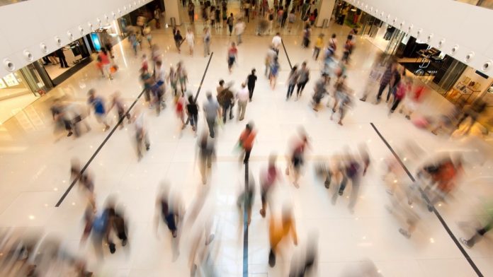 People walking in mall shopping